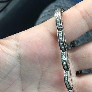 For sale classy white gold tennis bracelet.